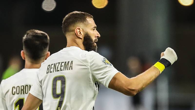 Karim Benzema poses with Al Ittihad jersey