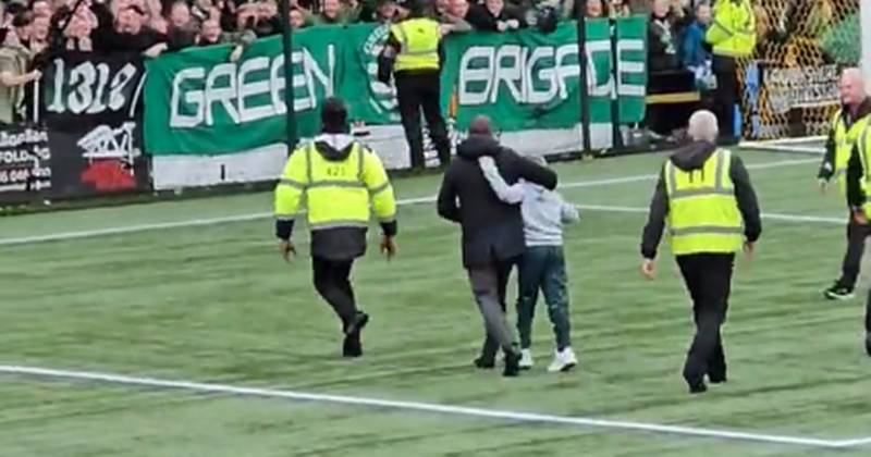 Brendan Rodgers pursues Celtic fan as he shoves off security to rescue pitch invader
