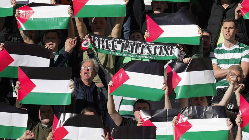 Celtic fans hold up Palestine flags during Scottish Premiership match at Hearts despite criticism from their own club over Palestinian support