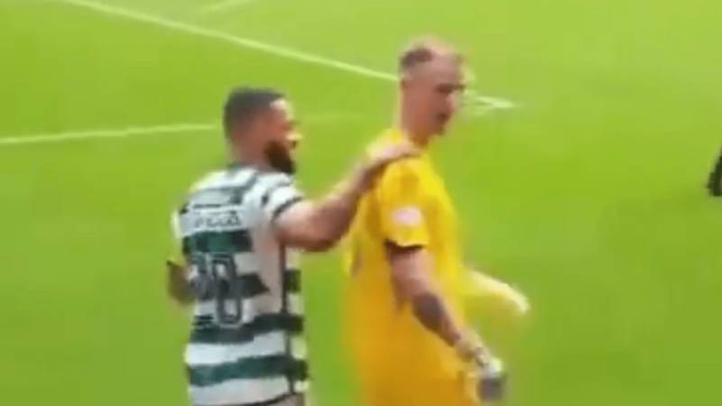 Shocking moment Celtic star Joe Hart is HELD BACK from Hearts fans by teammate after penalty strike